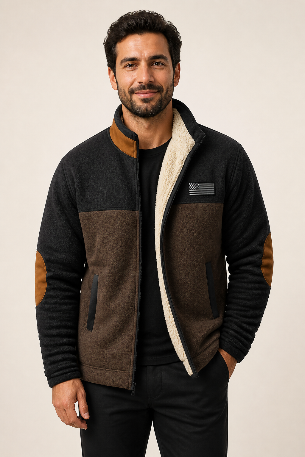 Men's black and brown sherpa-lined fleece jacket, worn by model in warm beige studio