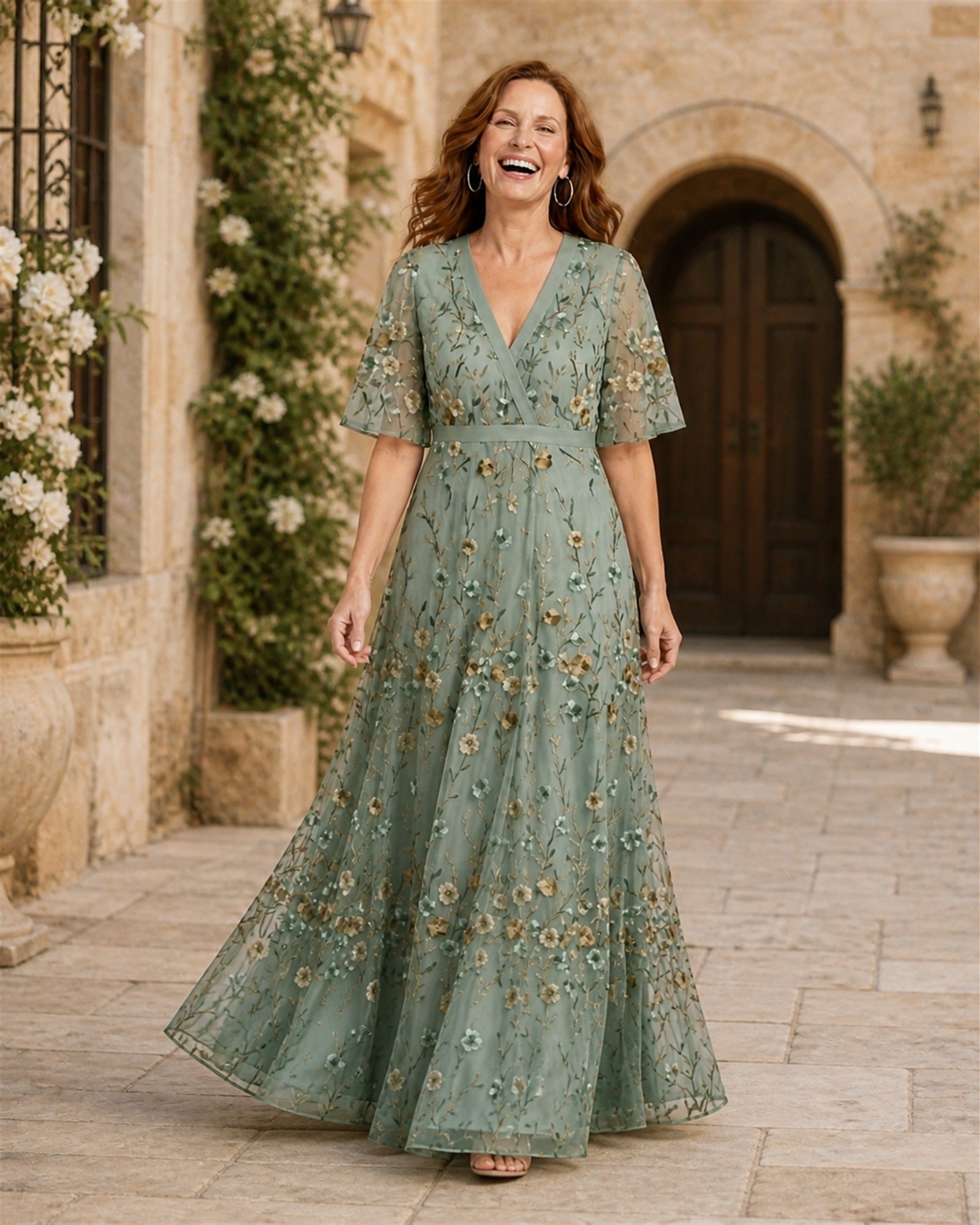 Ana-Roxana în rochie maxi verde salvie cu broderie florală, vedere frontală în exterior