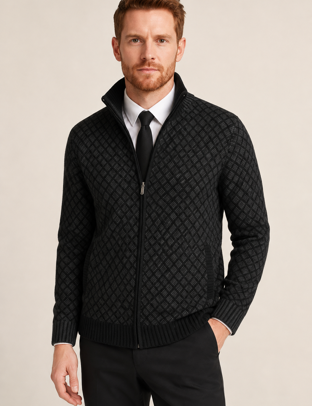 Men's black diamond-knit zip cardigan over shirt and tie, worn by model in warm beige studio