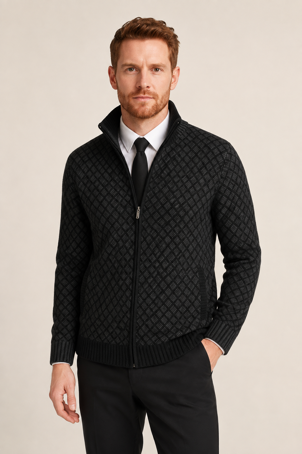 Men's black diamond-knit zip cardigan over shirt and tie, worn by model in warm beige studio