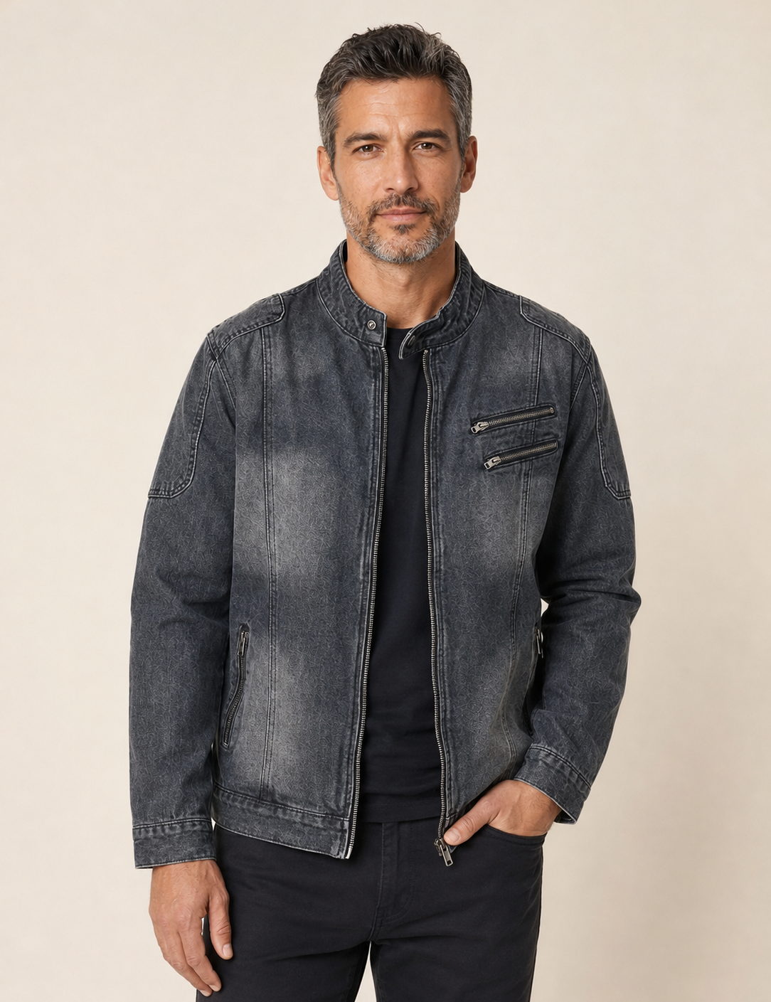 Men's charcoal washed denim vintage jacket, worn by model in warm beige studio