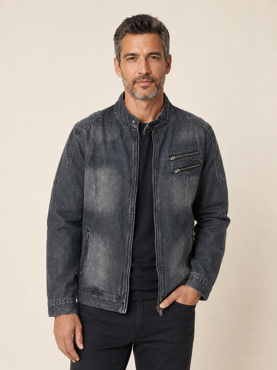 Men's charcoal washed denim vintage jacket, worn by model in warm beige studio